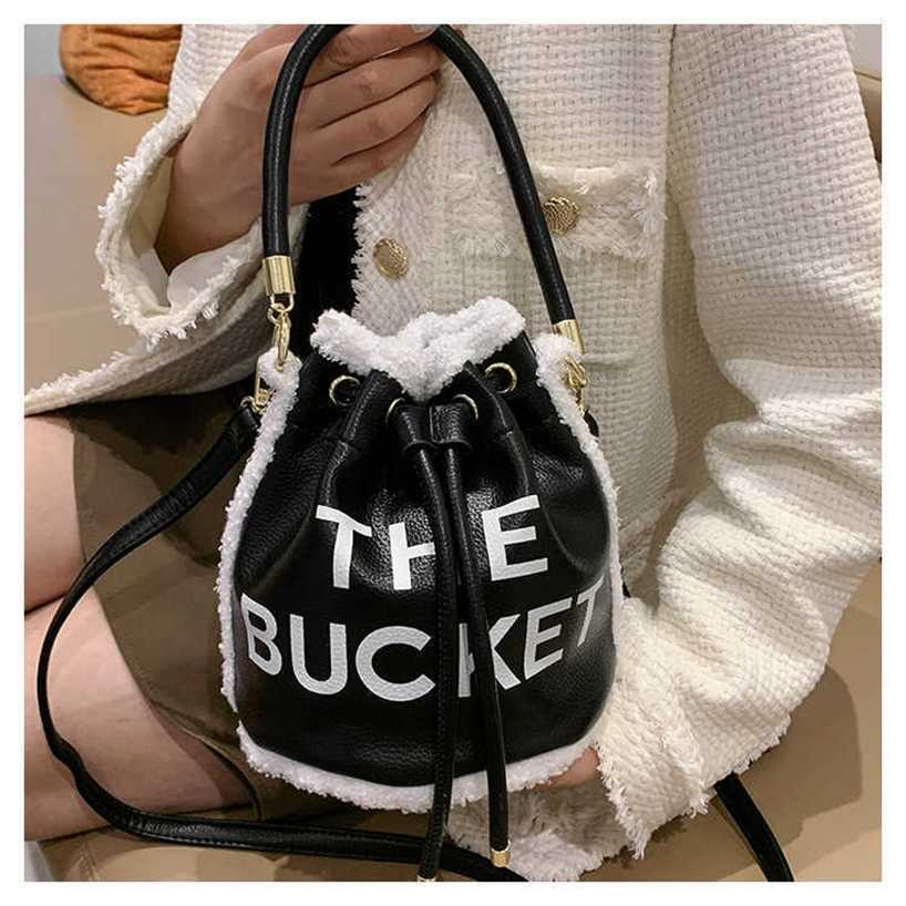 handbag 2023 Fashion women's bag leather quality handbag fashionable shoulder Handheld bucket for women fashion printed letter Small crowd plush messenger Bag, Khaki9
handbag 2023 Fashion women's bag leather quality handbag fashionable shoulder Handheld bucket for women fashion printed letter Small crowd plush messenger Bag, Khaki9