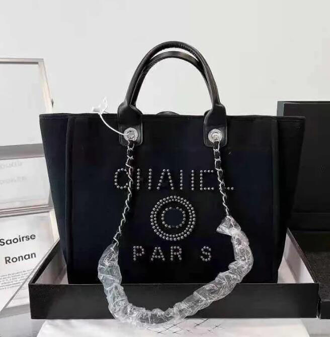 New Designer Shopping Bags Handbags Pearl Beach Bag Canvas Portable High-capacity Fashion Trend Women Bag CH001
New Designer Shopping Bags Handbags Pearl Beach Bag Canvas Portable High-capacity Fashion Trend Women Bag CH001