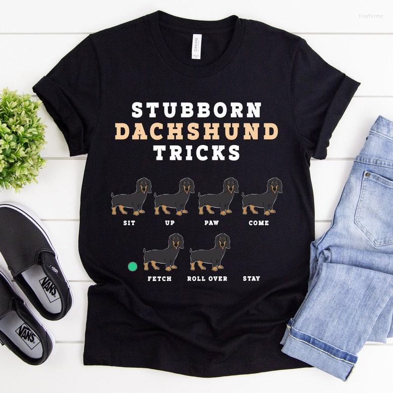 Women' T Shirts Stubborn Dachshund Tricks T-Shirt Dog Mom Lover Shirt Owner Funny Pup Gifts Fur Baby, Black
Women' T Shirts Stubborn Dachshund Tricks T-Shirt Dog Mom Lover Shirt Owner Funny Pup Gifts Fur Baby, Black