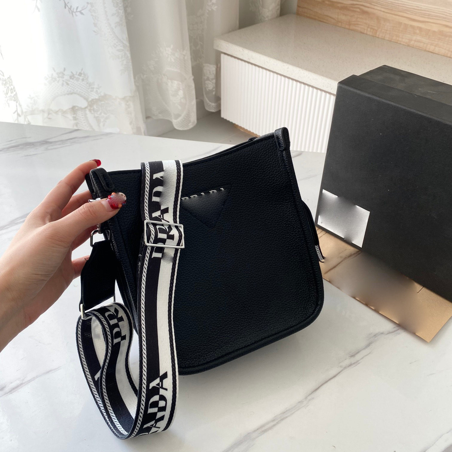 Prade Leather Mini Shoulder Bag Designer Bags Totebag Removable Logo Printed Webbing Shoulder Strap Womens Purses and Handbags 18X19X8cm, Black
Prade Leather Mini Shoulder Bag Designer Bags Totebag Removable Logo Printed Webbing Shoulder Strap Womens Purses and Handbags 18X19X8cm, Black