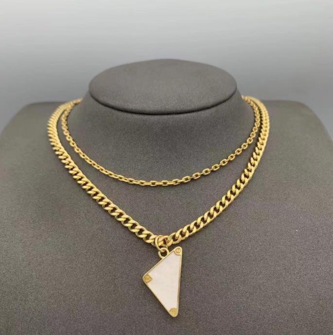Womens Mens Luxury Designer Necklace Chain Fashion Jewelry Black White P Triangle Pendant Design Party Silver Hip Hop Punk
Womens Mens Luxury Designer Necklace Chain Fashion Jewelry Black White P Triangle Pendant Design Party Silver Hip Hop Punk