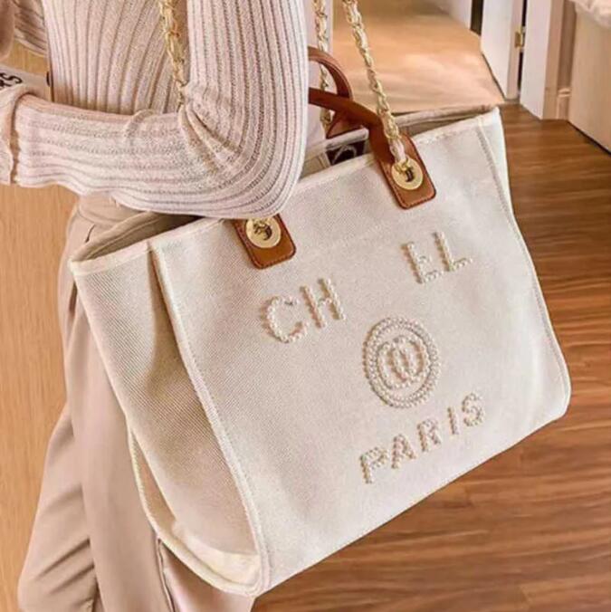 Designer Large capacity Beach Bags Luxury pearl tote seaside ladies shoulder handbags shopping bag Fashion Duffel bags handbag wallet CH07018, Black(black pearl)
Designer Large capacity Beach Bags Luxury pearl tote seaside ladies shoulder handbags shopping bag Fashion Duffel bags handbag wallet CH07018, Black(black pearl)