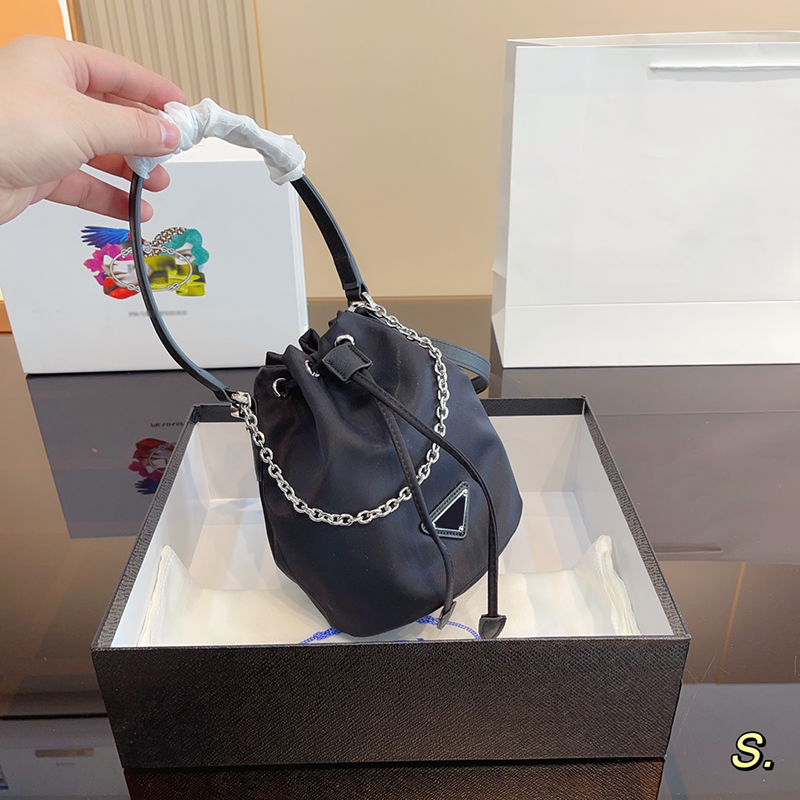 Womens Nylon Drawstring Bucket Bags Handbag Purses Leather Shoulder Strap Handle Brand Triangle P Sign Waterproof Crossbody Bag 2305071BF, P-black
Womens Nylon Drawstring Bucket Bags Handbag Purses Leather Shoulder Strap Handle Brand Triangle P Sign Waterproof Crossbody Bag 2305071BF, P-black
