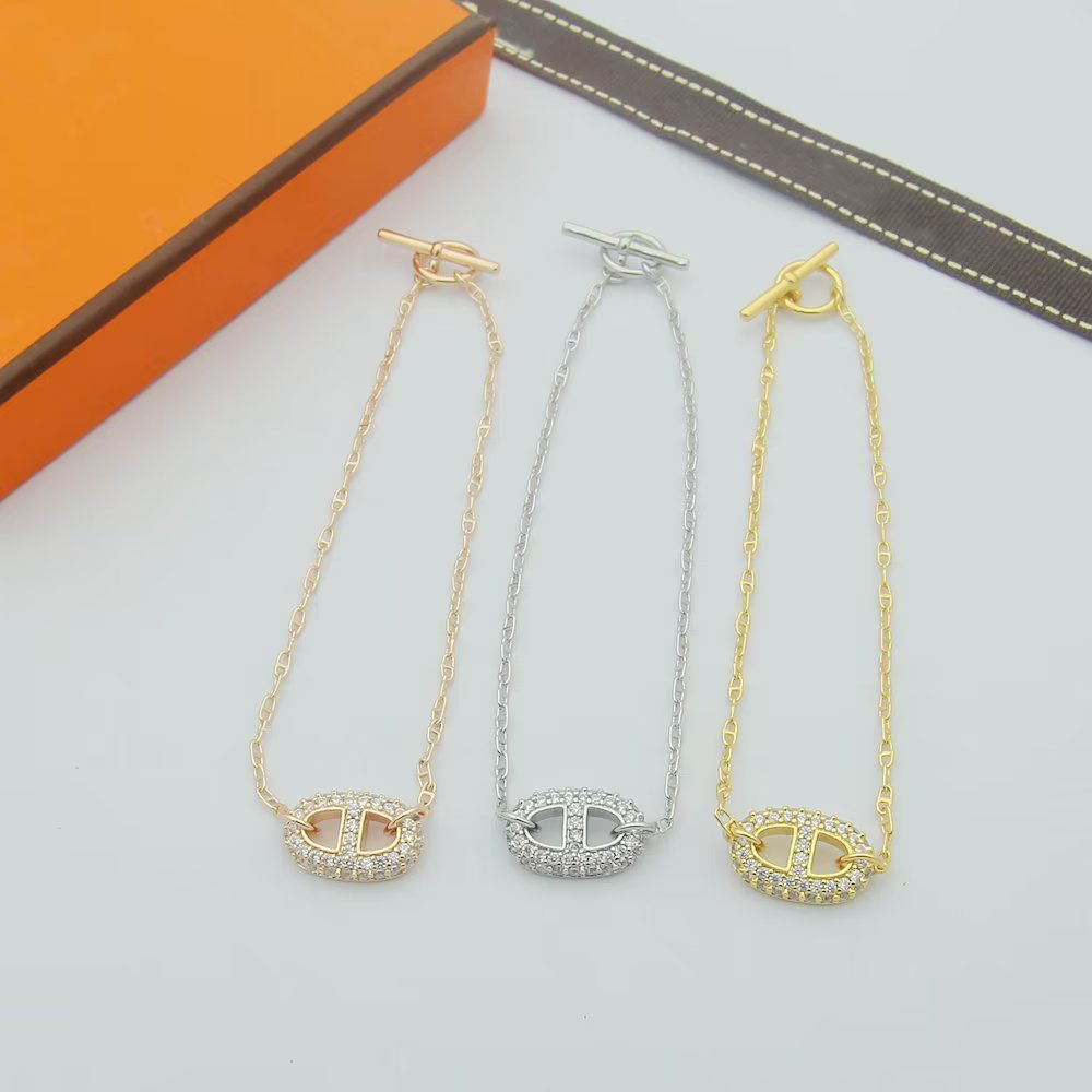 Luxury gold full diamond pig nose bracelet for women OT clasp simple branded bracelet jewellery gift for wife
Luxury gold full diamond pig nose bracelet for women OT clasp simple branded bracelet jewellery gift for wife