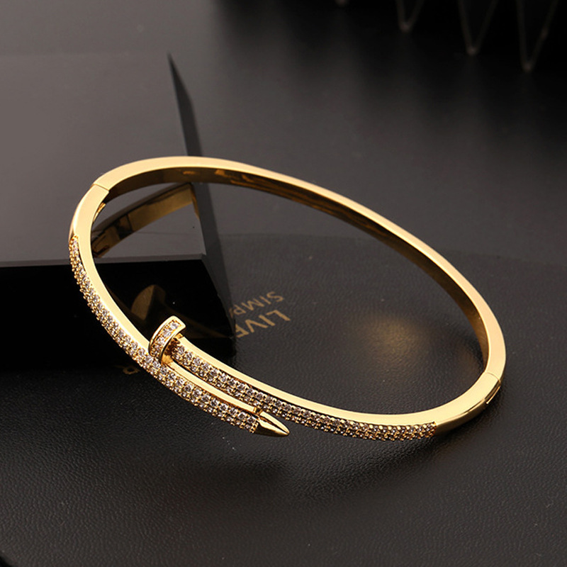 Fashionable and Personalized Diamond Studded Nail Women's Bracelet With Non Fading 18k Gold Plating
Fashionable and Personalized Diamond Studded Nail Women's Bracelet With Non Fading 18k Gold Plating