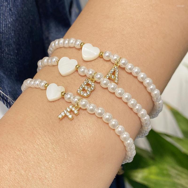 Strand Shell Heart Love Name Bracelet For Women Round Simulated Pearls Inlay Zircon Letter Initial Pendant Jewelry
Strand Shell Heart Love Name Bracelet For Women Round Simulated Pearls Inlay Zircon Letter Initial Pendant Jewelry