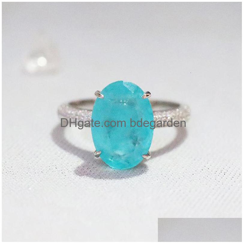 With Side Stones 925 Sterling Sier Oval Finger Rings For Women Elegant Paraiba Tourmaline Ring Classic Engagement Statement Dhsxs 
With Side Stones 925 Sterling Sier Oval Finger Rings For Women Elegant Paraiba Tourmaline Ring Classic Engagement Statement Dhsxs
