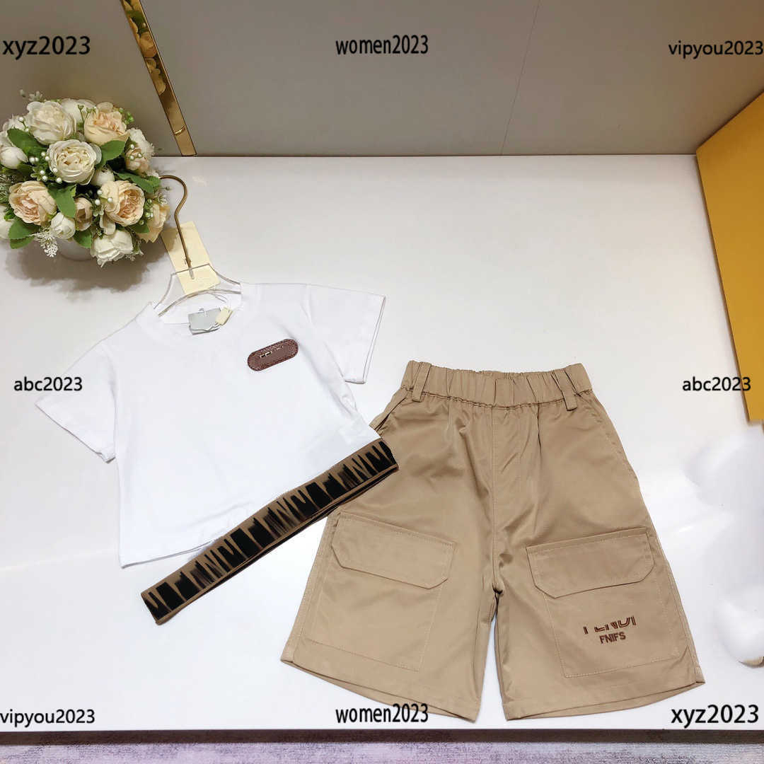 Tracksuits kids designer clothes T-shirt Set Size -160 CM 2pcs Letter printed ribbon T-shirt and Pocket decorative shorts May10, #1
Tracksuits kids designer clothes T-shirt Set Size -160 CM 2pcs Letter printed ribbon T-shirt and Pocket decorative shorts May10, #1