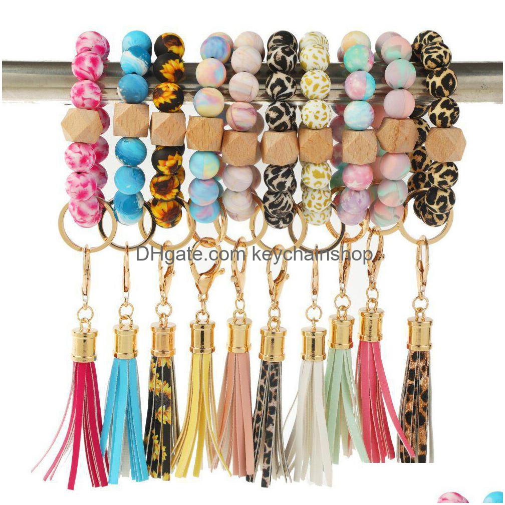 Key Rings Sile Beads Keychain Tassel Bracelet Favor Wood Beaded Ring Handbag Charms Women Jewelry Wristring Gift Drop Delivery Dhlzw
Key Rings Sile Beads Keychain Tassel Bracelet Favor Wood Beaded Ring Handbag Charms Women Jewelry Wristring Gift Drop Delivery Dhlzw