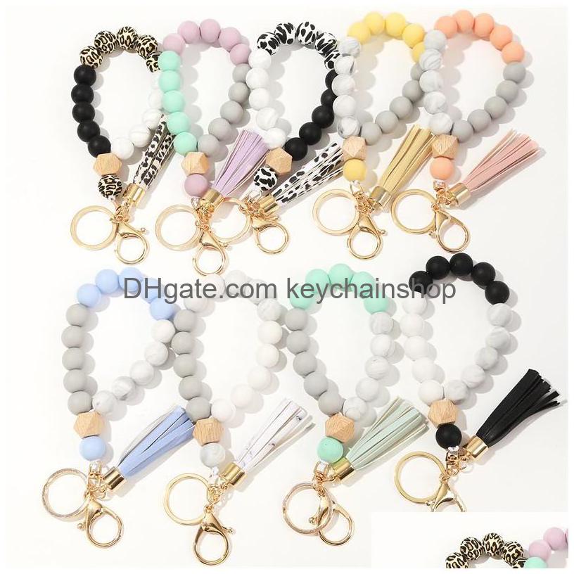 Key Rings Party Favor Keychain Wood Bead Sile Beads With Tassel String Chain Women Girl Ring Wrist Bracelet Drop Delivery Jewelry Dhjlt
Key Rings Party Favor Keychain Wood Bead Sile Beads With Tassel String Chain Women Girl Ring Wrist Bracelet Drop Delivery Jewelry Dhjlt