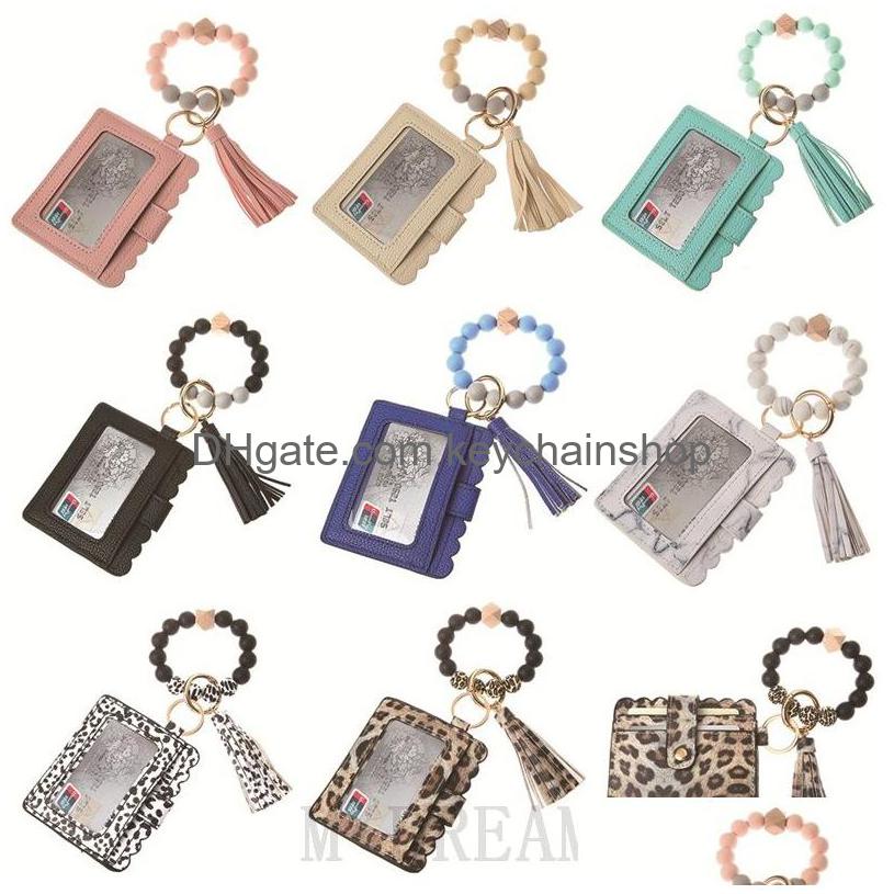 Key Rings Pu Leather Bracelet Card Package Keychain Party Favor Tassels Bangle Ring Bags Sile Beaded Wristlet Keychains Drop Deliver Dhfpm
Key Rings Pu Leather Bracelet Card Package Keychain Party Favor Tassels Bangle Ring Bags Sile Beaded Wristlet Keychains Drop Deliver Dhfpm