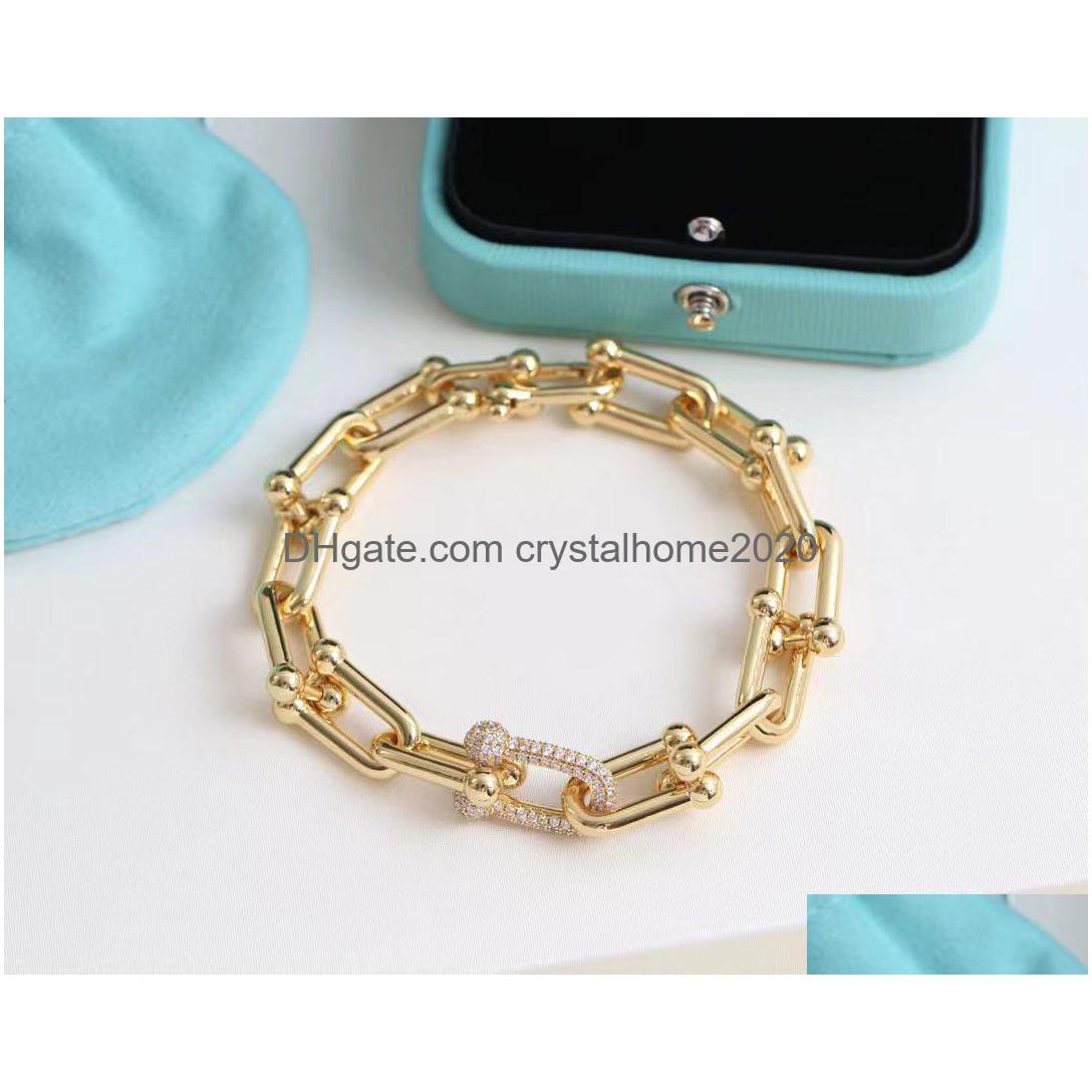 Charm Bracelets Brand Link Chain Cham Hip Hop Copper Luxury Horseshoe Designer Bling Shining Crystal Diamond Choker Dhbi8
Charm Bracelets Brand Link Chain Cham Hip Hop Copper Luxury Horseshoe Designer Bling Shining Crystal Diamond Choker Dhbi8