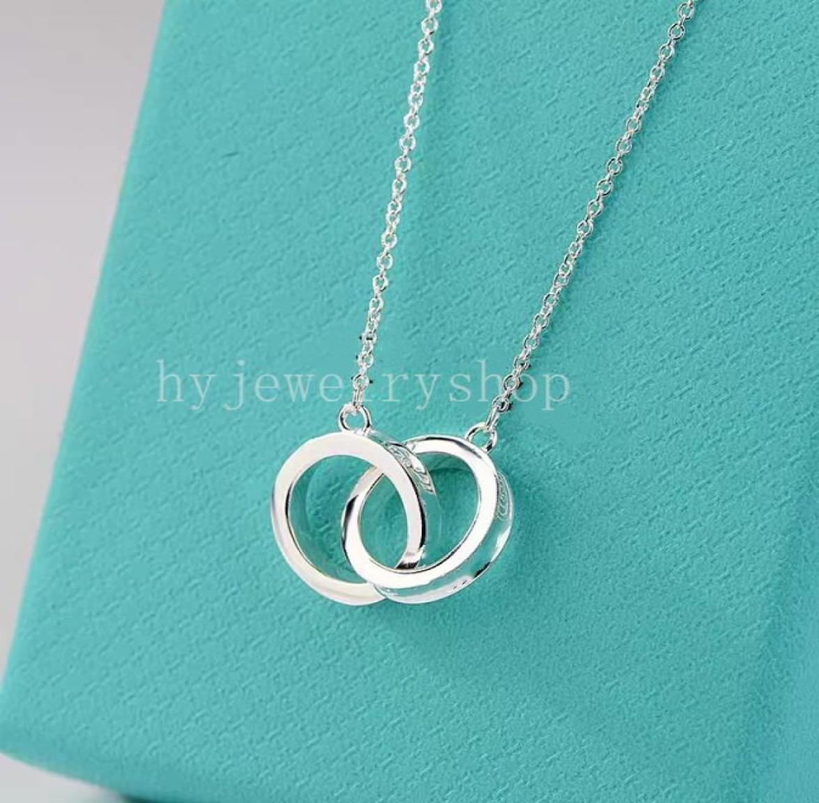 T Designer two ring pendant Necklace bracelet stud earrings Women Luxury Brand Jewelry Classic Fashion 925 sterlling silver rose g4738867
T Designer two ring pendant Necklace bracelet stud earrings Women Luxury Brand Jewelry Classic Fashion 925 sterlling silver rose g4738867