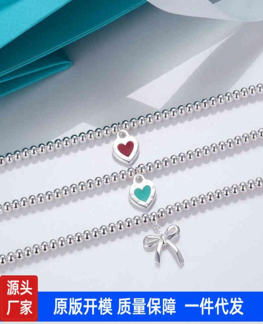 Seiko version t family love Bow Bracelet Red and blue enamel CNC steel seal peach heart pendant Buddha bead Round Ball6309211
Seiko version t family love Bow Bracelet Red and blue enamel CNC steel seal peach heart pendant Buddha bead Round Ball6309211