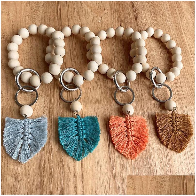 Keychains Lanyards Wooden Beaded Keychain Bracelet Key Chain Hand Woven Tassel Pendant Car Keyring Drop Delivery Fashion Accessorie Dhidr
Keychains Lanyards Wooden Beaded Keychain Bracelet Key Chain Hand Woven Tassel Pendant Car Keyring Drop Delivery Fashion Accessorie Dhidr