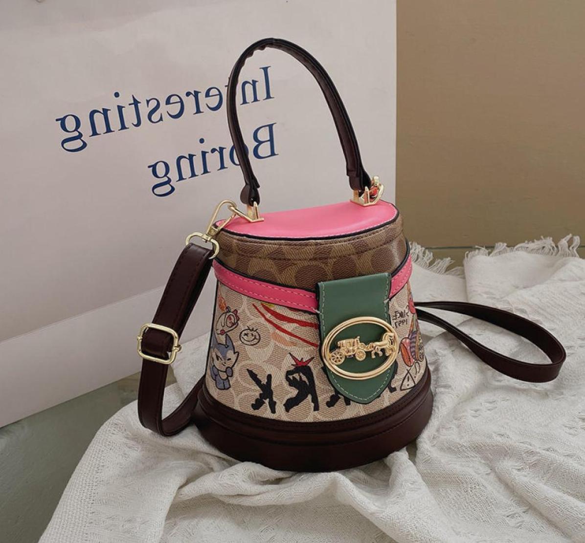 Designer Bags Bucket Women 2022 New Graffiti Printing Cylinder Handbag High Sense Women039s Messenger Small8777569, Sky blue
Designer Bags Bucket Women 2022 New Graffiti Printing Cylinder Handbag High Sense Women039s Messenger Small8777569, Sky blue