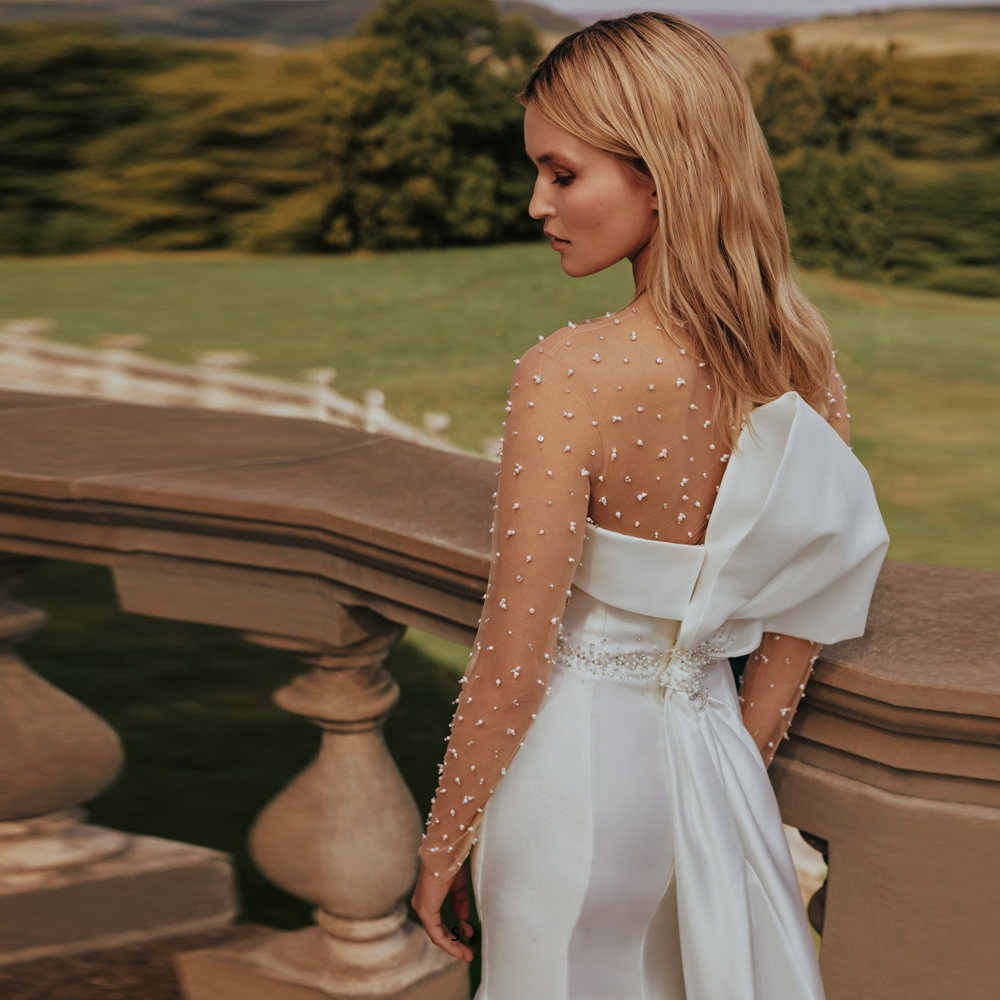 Exquisite Sheer Mermaid Wedding Dresses Beaded Long Sleeve Bridal Gown Button Back Satin Big Bow Tie Rode De Morrie