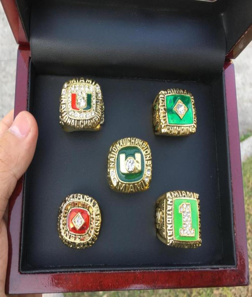 5 Pcs 1983 1987 1989 1991 2001 Miami Hurricanes National Championship Ring Set With Wooden Display Box Case Fan Gift 2019 Drop Shi2296071
5 Pcs 1983 1987 1989 1991 2001 Miami Hurricanes National Championship Ring Set With Wooden Display Box Case Fan Gift 2019 Drop Shi2296071