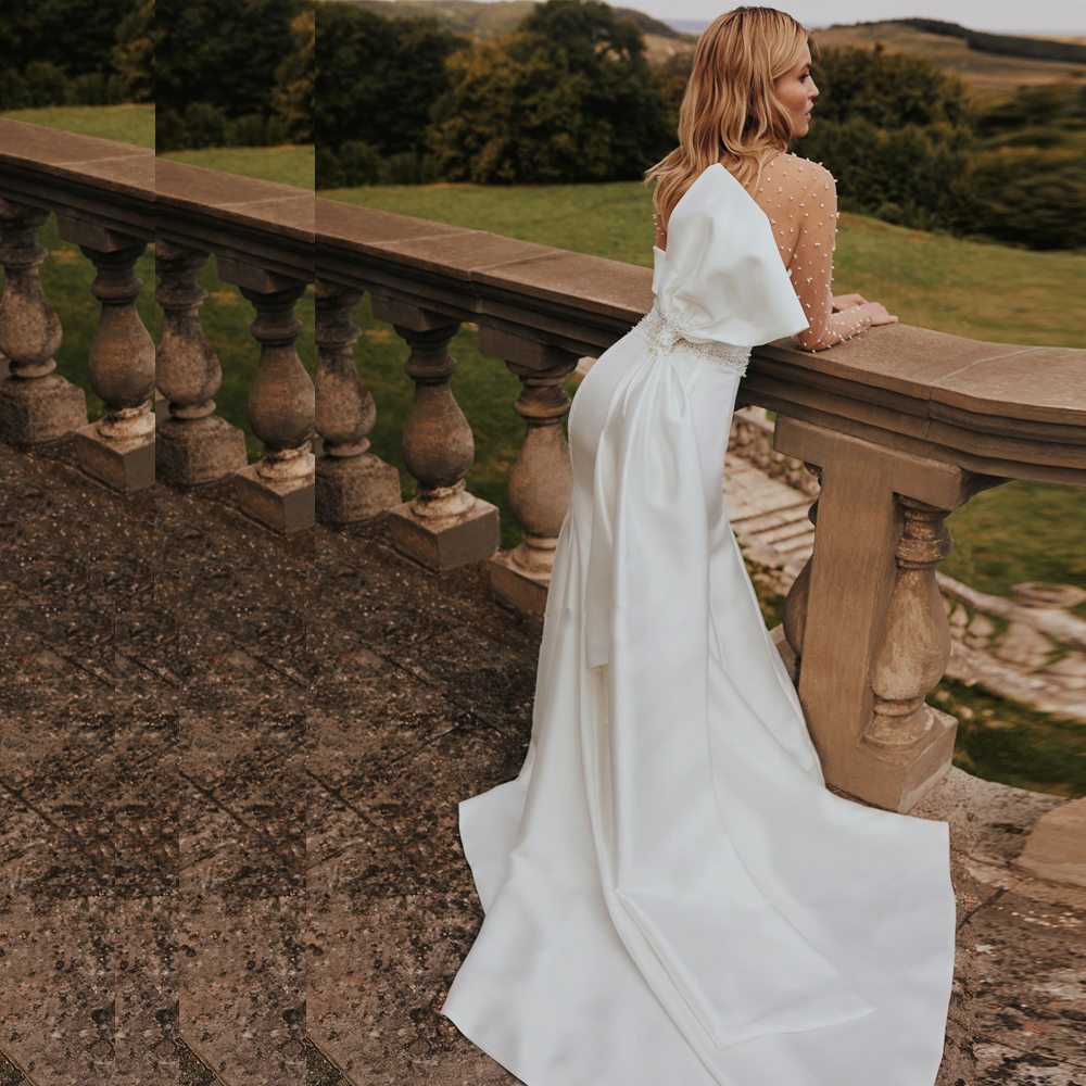 Exquisite Sheer Mermaid Wedding Dresses Beaded Long Sleeve Bridal Gown Button Back Satin Big Bow Tie Rode De Morrie
