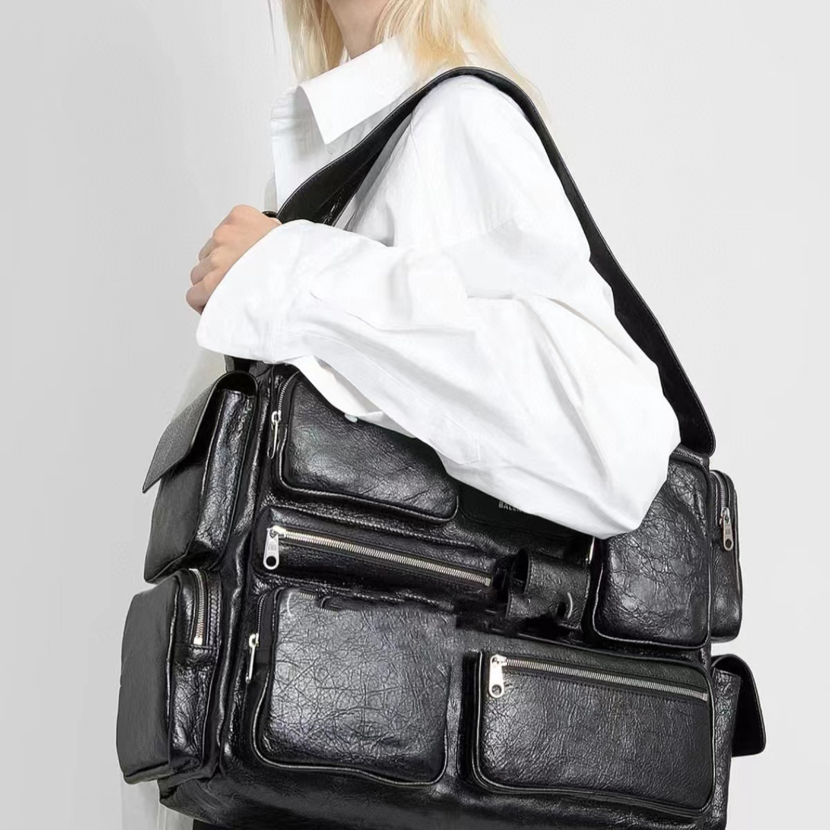 Designer motorcycle bag Large Sling Bag black Arena lambskin Aged Silver Hardware Lost Tape Collection Bb logo engraved on zip puller Luxury Designer Shoulder Bag