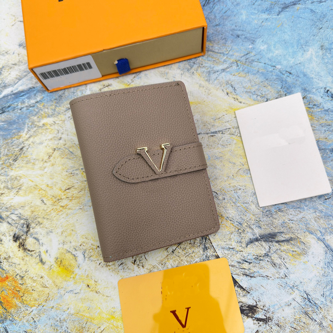 fashion high-quality men Womens designer Vertical Wallets luxurys purse classic flower letter short card holder Taurillon Leather Letter sliding buckle
