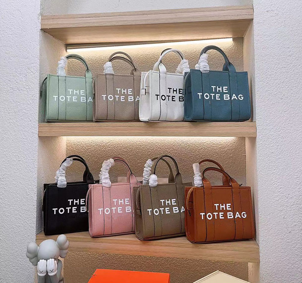 The tote bag Designer bags Women men High quality leather Fashion high-capacity Shoulder bag Letter printing Shopping Handbag 2 sizes multiple colors 25CM 34CM