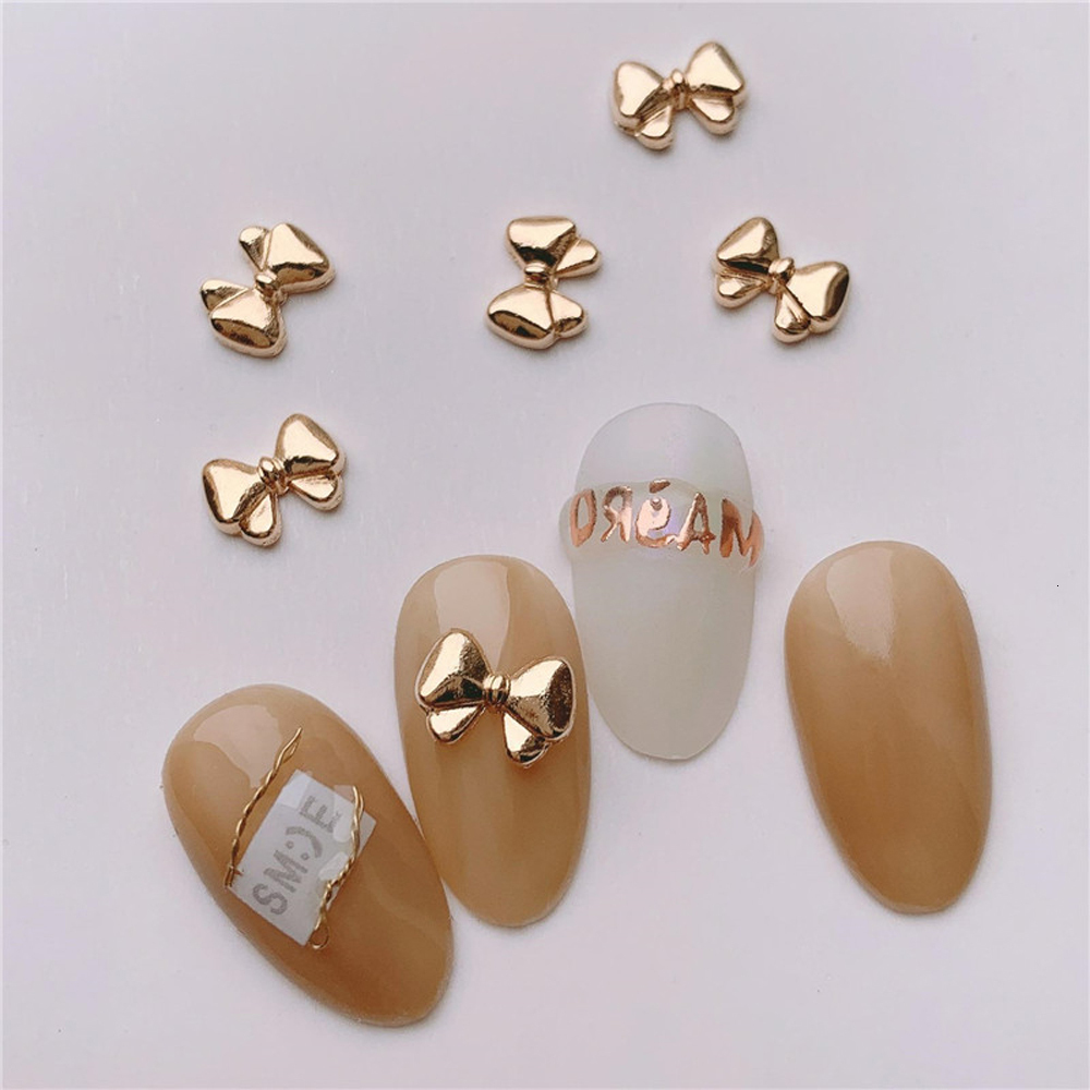 Nail Art Decorations 100 Mini Cute Bow Nail Decoration Vintage Gold Chrome Bow Alloy Charm 3D Bow Parts Finger Decoration 230718