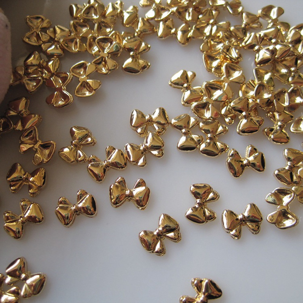 Nail Art Decorations 100 Mini Cute Bow Nail Decoration Vintage Gold Chrome Bow Alloy Charm 3D Bow Parts Finger Decoration 230718