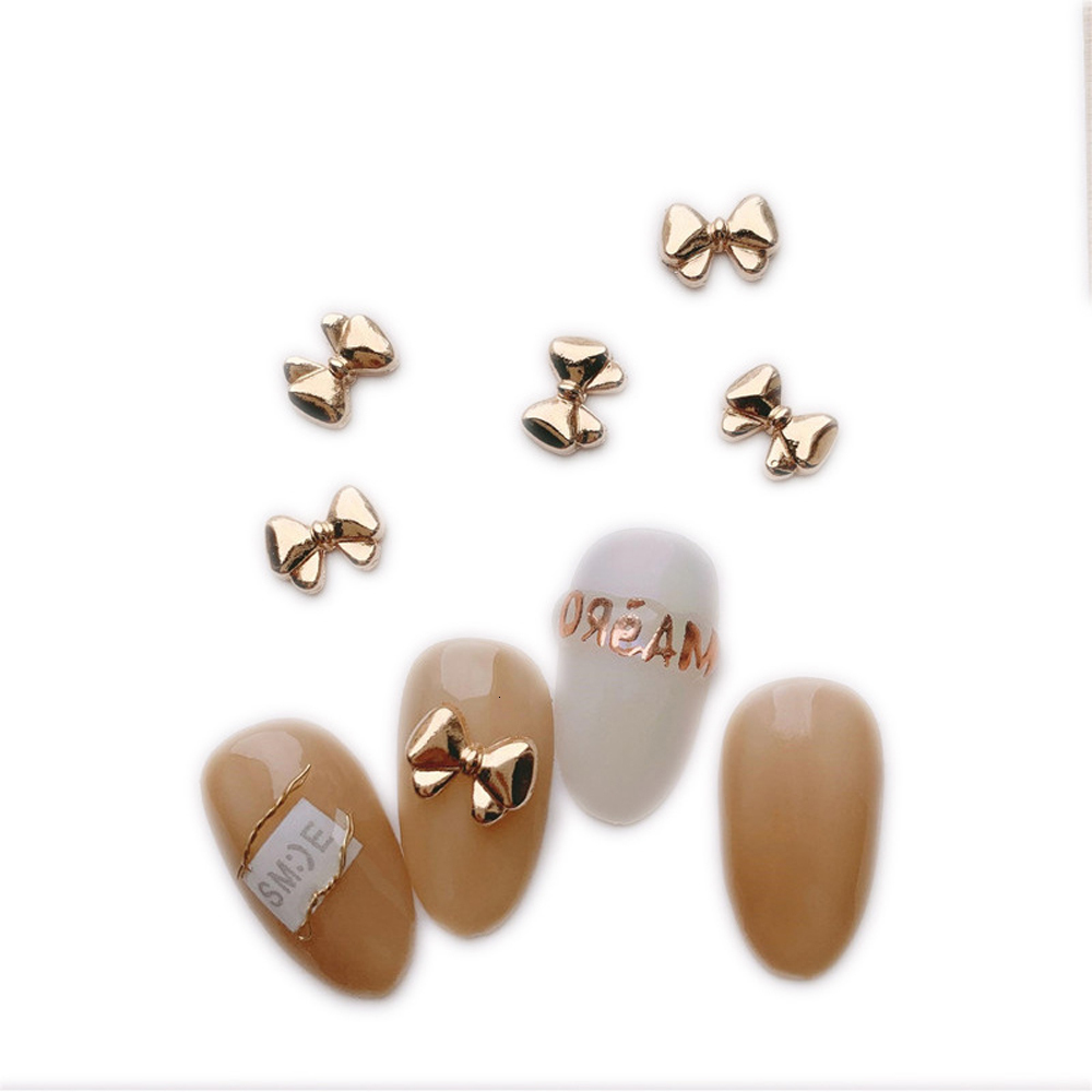 Nail Art Decorations 100 Mini Cute Bow Nail Decoration Vintage Gold Chrome Bow Alloy Charm 3D Bow Parts Finger Decoration 230718
