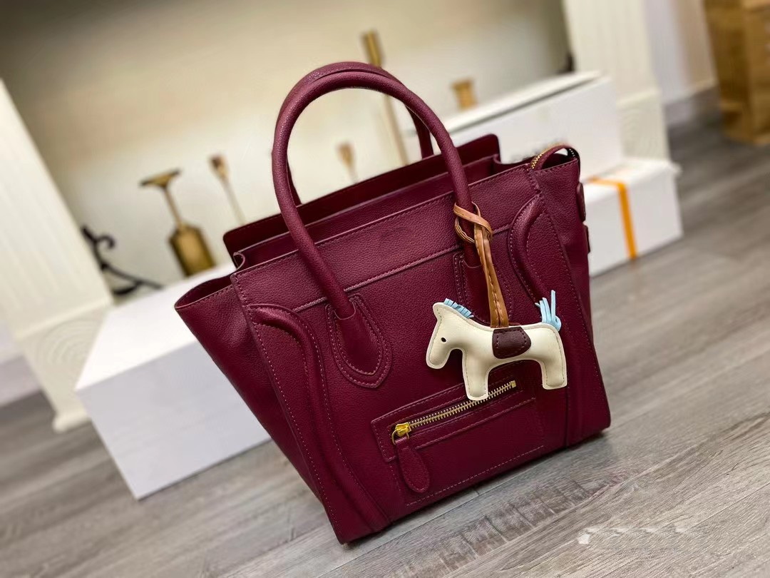 2023 large-capacity women's lychee pattern smiley bag genuine leather women's bag clown face bat bag wing one-shoulder Messenger handbag small size at 881735796 link
