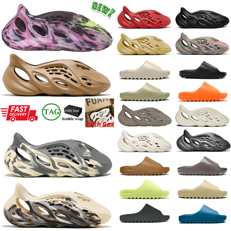 Designers Slides Foamrunners Mens Womens Slippers Mx Carbon Onyx Ochre Glow Green Bone Black Pure Resin Soot Foam Slide Rubber Slipper, Foam-orangen
Designers Slides Foamrunners Mens Womens Slippers Mx Carbon Onyx Ochre Glow Green Bone Black Pure Resin Soot Foam Slide Rubber Slipper, Foam-orangen