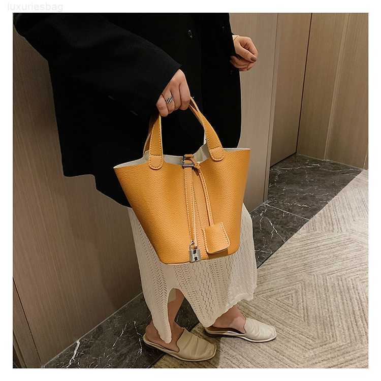 Designer Luxury Winter Version Vegetable Basket Mother Water Bucket Lychee Pattern Simple Versatile Handbag Women's BagG6EV8SOD Picotin, Brown
Designer Luxury Winter Version Vegetable Basket Mother Water Bucket Lychee Pattern Simple Versatile Handbag Women's BagG6EV8SOD Picotin, Brown