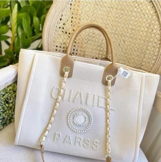 New Designer Shopping Bags Handbags Pearl Beach Bag Canvas Portable High-capacity Fashion Trend Women Bag CH00106
New Designer Shopping Bags Handbags Pearl Beach Bag Canvas Portable High-capacity Fashion Trend Women Bag CH00106