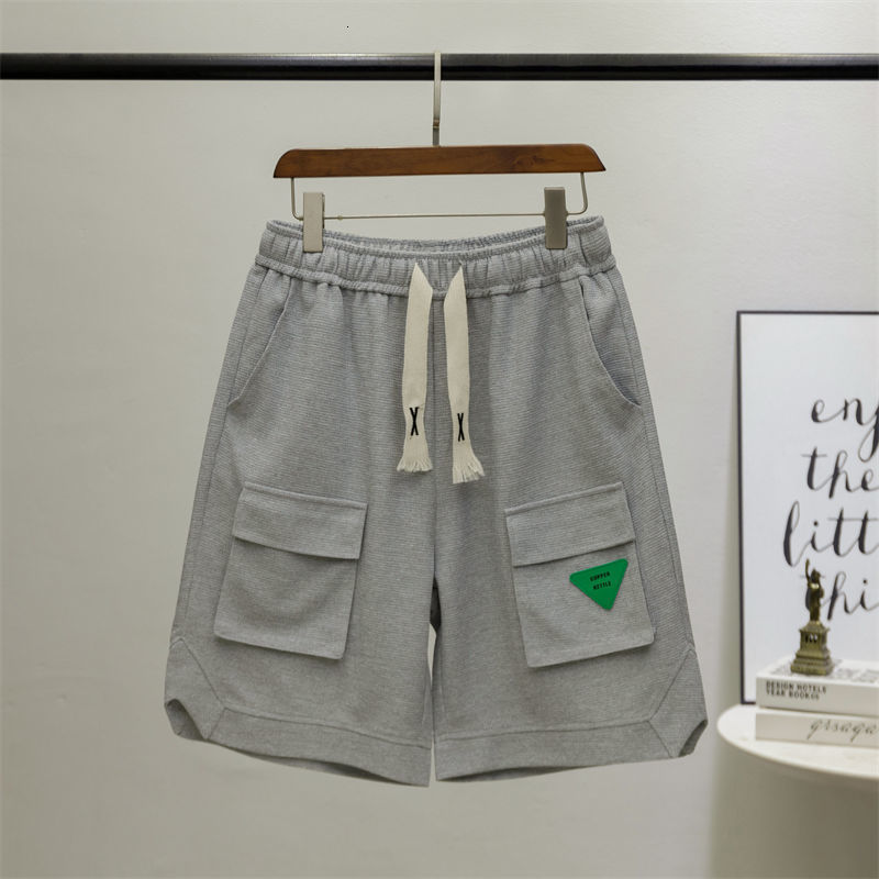 Men's Shorts Personalized shorts street goods large pockets half pants green leather labels drawstring casual shorts men's youth pants Capri