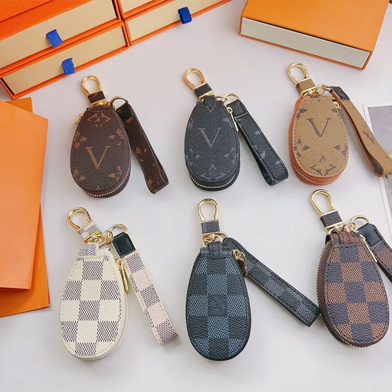 2023 Luxury Brand Satellite Bag Charm Fashion Women Keychain Brown Plaid PU Leather Gold Metal Keychain Bracket Pendant Fashion Design Bag Jewelry Gift