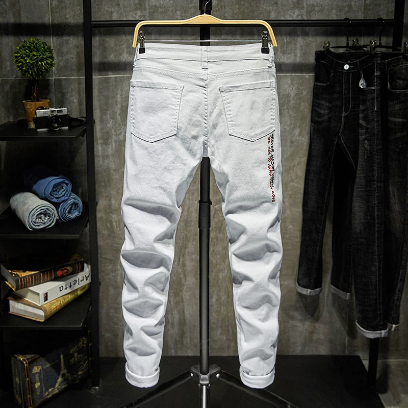 Men's Jeans Fashion Trendy Embroidery letters Men College Boys Skinny Runway Zipper Denim Pants Destroyed Ripped Jeans Black White Jeans 231110