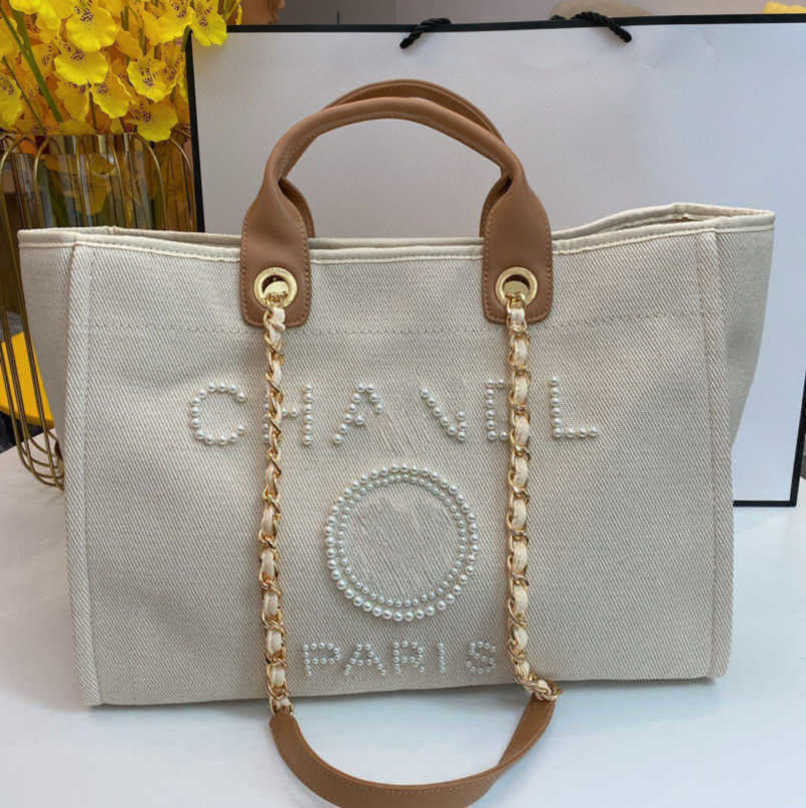 Luxury Women's Fashion Evening Bags Ch Brand Handbag Classic Canvas Beach Bag Designers Female Large Backpacks Capacity Small Chain Packs Big Shopping Handbags 1VA7, Size45x30x15cm
Luxury Women's Fashion Evening Bags Ch Brand Handbag Classic Canvas Beach Bag Designers Female Large Backpacks Capacity Small Chain Packs Big Shopping Handbags 1VA7, Size45x30x15cm