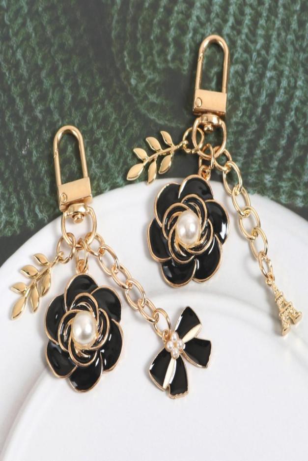 Camellia Black Bow Keychain Pearl Fashion Jewelry Pendant Luxury Flower Car Bag Key Ring Antilost Gift Accessories Whole9079492
Camellia Black Bow Keychain Pearl Fashion Jewelry Pendant Luxury Flower Car Bag Key Ring Antilost Gift Accessories Whole9079492