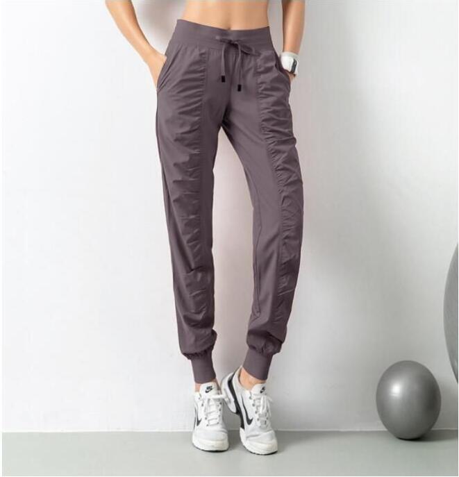Yoga Breathable Sports Pants Gym Clothes Women's Joggers Quick Dry Slim Loose Running Training Fiess Leggings Nine Point Pocket Casual Trouses