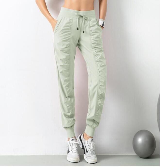 Yoga Breathable Sports Pants Gym Clothes Women's Joggers Quick Dry Slim Loose Running Training Fiess Leggings Nine Point Pocket Casual Trouses