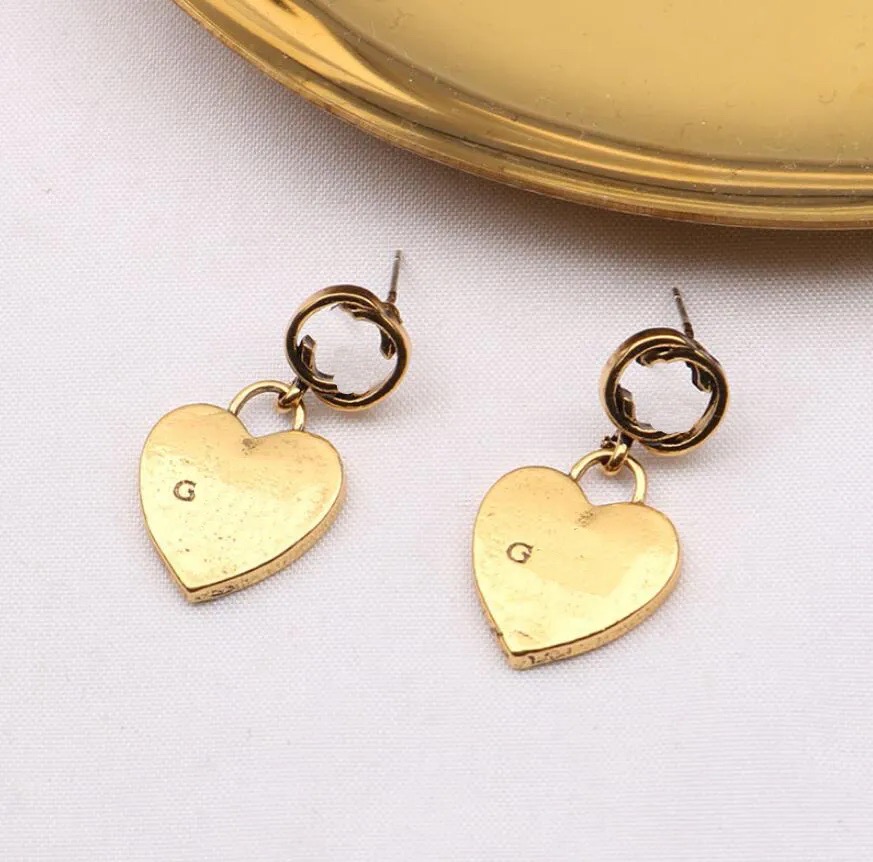 Women Classic Designer stud earrings Brand Letter Steel Seal High Quality Geometric Heart Earrings Gold Color Word Ear Studs EarRing for Womens Fashion
Women Classic Designer stud earrings Brand Letter Steel Seal High Quality Geometric Heart Earrings Gold Color Word Ear Studs EarRing for Womens Fashion
