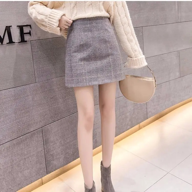 Skirts Spring autumn and winter skirt women Korean version of high waist slim fashion plaid wool Joker Slim A-step skirt 231121