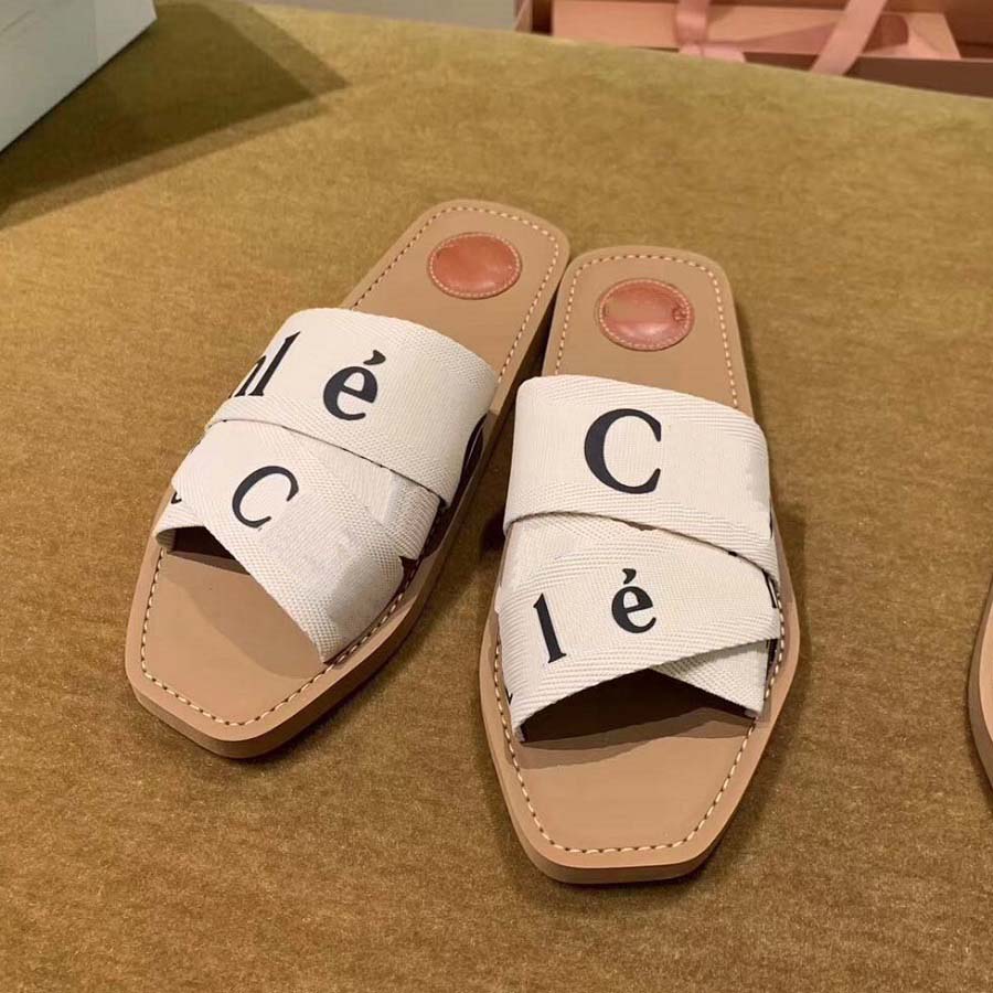 Designer Slippers Sliders Slides Sandals Woody Flat Mules Webbing slip-on sandals in off-white Crisscrossing straps with logo bonded in black at vamp, #2
Designer Slippers Sliders Slides Sandals Woody Flat Mules Webbing slip-on sandals in off-white Crisscrossing straps with logo bonded in black at vamp, #2