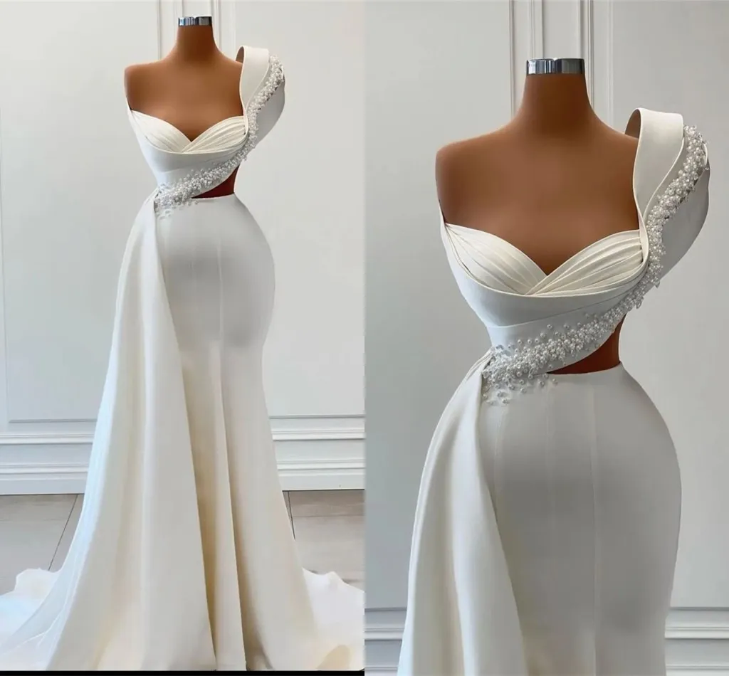 2023 Designer Mermaid Wedding Dresses Bridal Gown Crystals Peals Beaded Straps Satin One Shoulder Ruffles Custom Made Vestidos de novia Plus Size, Black
2023 Designer Mermaid Wedding Dresses Bridal Gown Crystals Peals Beaded Straps Satin One Shoulder Ruffles Custom Made Vestidos de novia Plus Size, Black