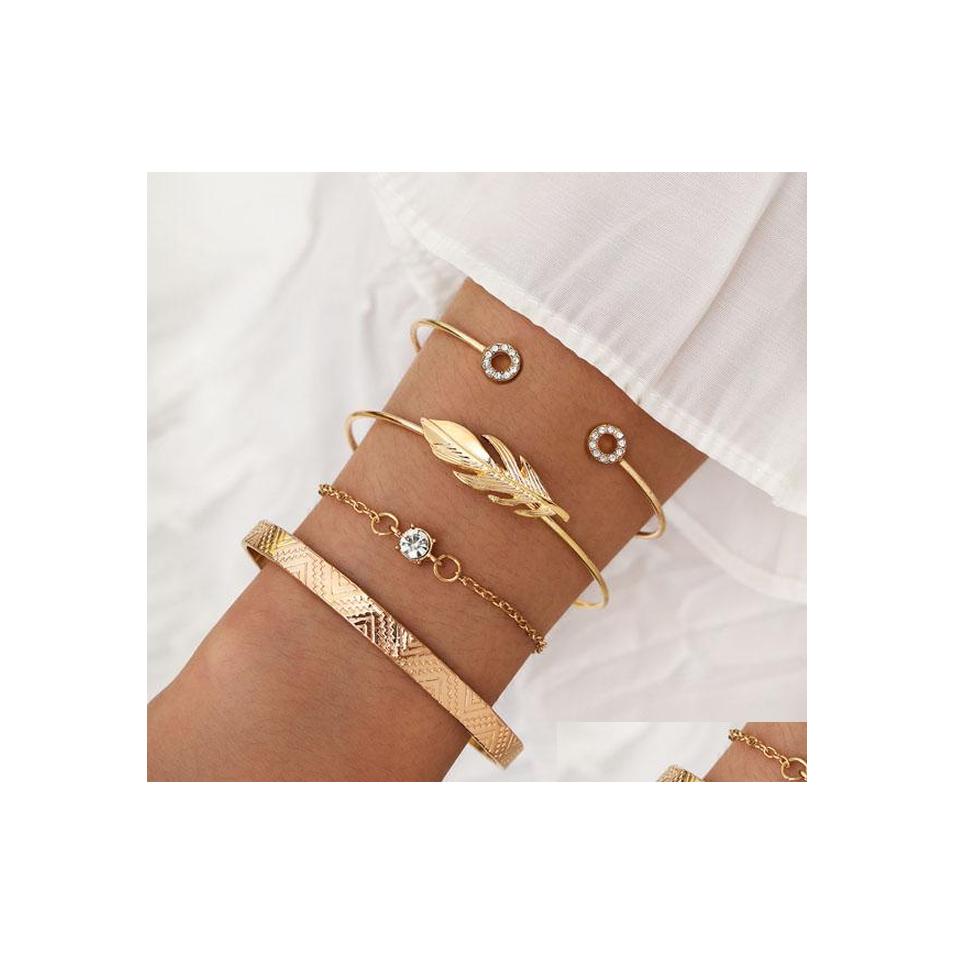 Charm Bracelets Fashion Jewelry Bracelet Set Metal Feather Rhinstone Bangle Chain 4Pcs Drop Delivery Dhlh7
Charm Bracelets Fashion Jewelry Bracelet Set Metal Feather Rhinstone Bangle Chain 4Pcs Drop Delivery Dhlh7
