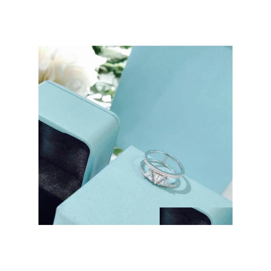 Wedding Rings Women Hewelry Engagement Ring Jewelry 925 Sterling Sier Triangle Hollow White Gold Drop Delivery Dhjmn
Wedding Rings Women Hewelry Engagement Ring Jewelry 925 Sterling Sier Triangle Hollow White Gold Drop Delivery Dhjmn