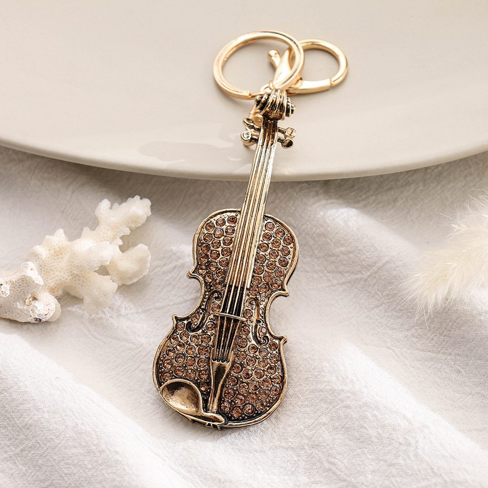 Luxury Rhinestone Guitar Shape Small Gift Package Pendant Alloy Tarnish Keychain Ornaments Little Creative Gifts
Luxury Rhinestone Guitar Shape Small Gift Package Pendant Alloy Tarnish Keychain Ornaments Little Creative Gifts