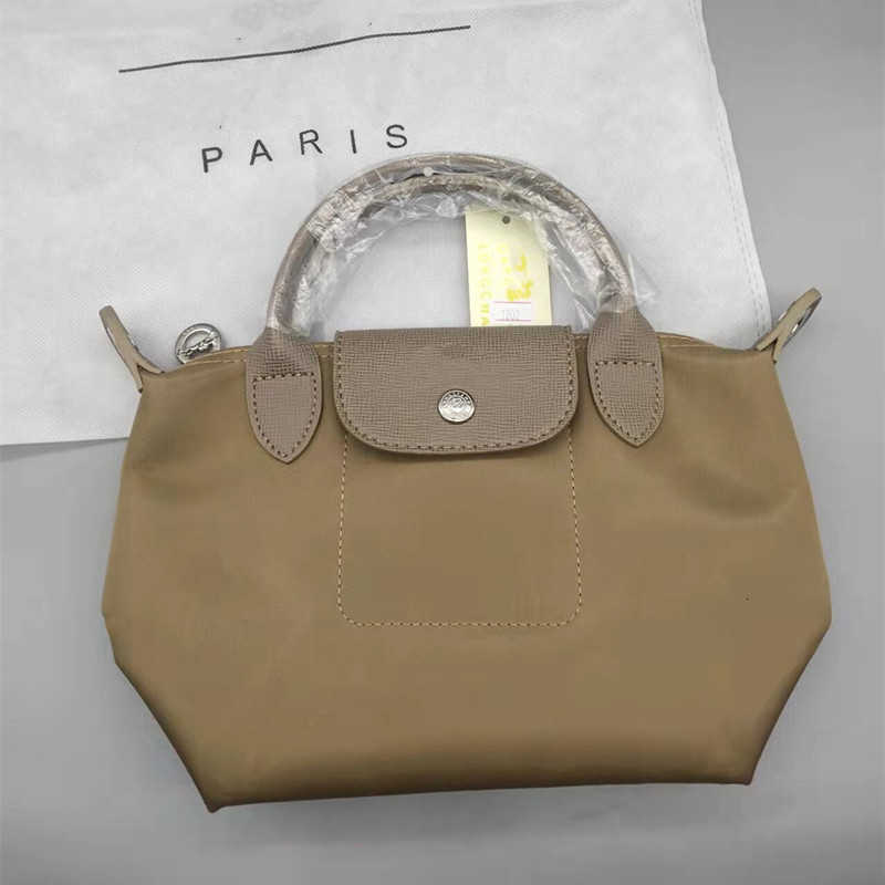 Handbag Clearance Messenger Bag Thickened Nylon Dumpling Retail Wholesale Classic Waterproof Brand Women crossbody bags Portable Small Medium Large handbags, Small light purple with logo
Handbag Clearance Messenger Bag Thickened Nylon Dumpling Retail Wholesale Classic Waterproof Brand Women crossbody bags Portable Small Medium Large handbags, Small light purple with logo