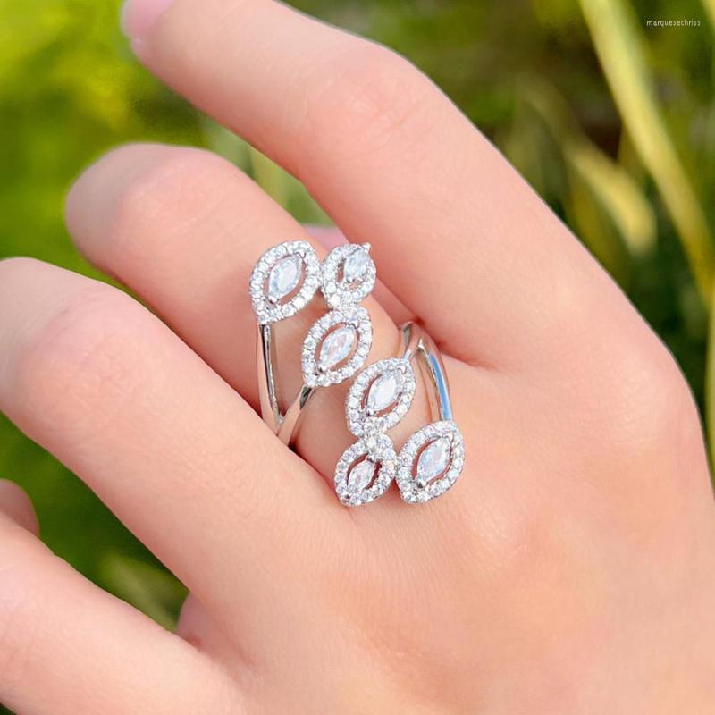 Wedding Rings CWWZircons Adjustable Top Bling CZ Stones Leaf Shape Long Finger For Women Engagement Jewelry Accessories R259
Wedding Rings CWWZircons Adjustable Top Bling CZ Stones Leaf Shape Long Finger For Women Engagement Jewelry Accessories R259
