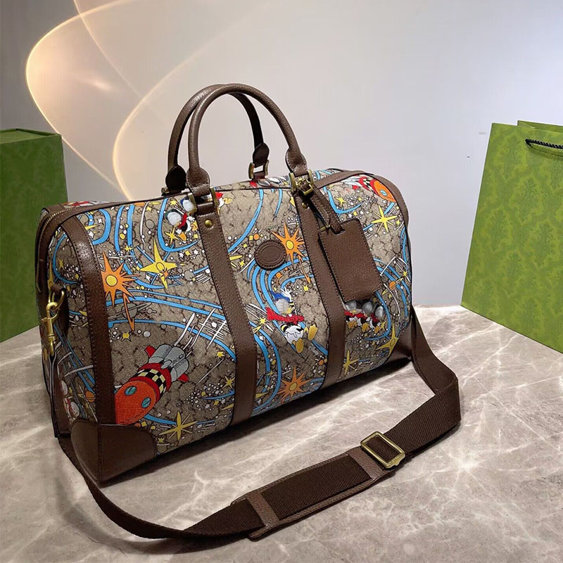 New Men Duffle Bag Women Travel Bags Luxury Fashion Handnbag Designer Luggage Canvans Cartoon CrossBody Bags Totes Airport Bag 45cm, Brown 
New Men Duffle Bag Women Travel Bags Luxury Fashion Handnbag Designer Luggage Canvans Cartoon CrossBody Bags Totes Airport Bag 45cm, Brown